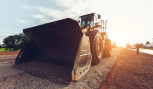 Wheel loader performing land grading and leveling work on a Manatee County construction site